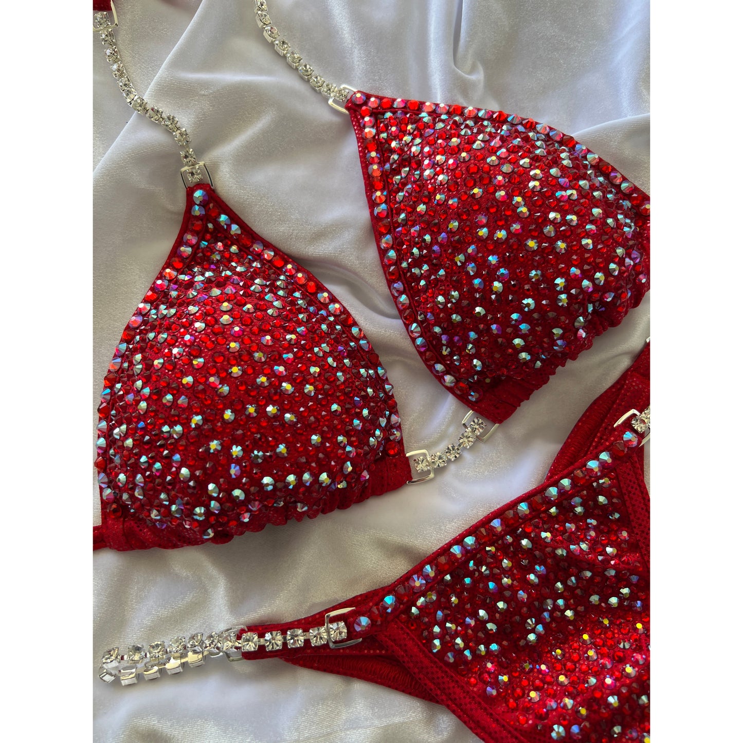 Camryn’s Fire engine red full scatter suit with trimmed crystal edge